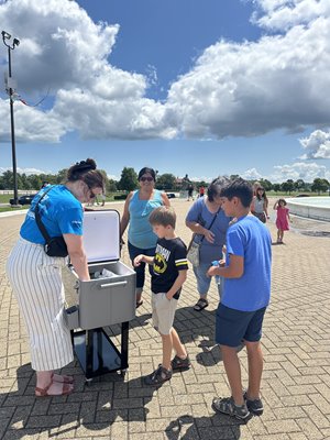 One of our team members handing out ice cream on Belle Isle. 