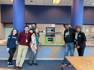 Southfield Public Library staff enjoying a pizza party courtesy of Michigan First.