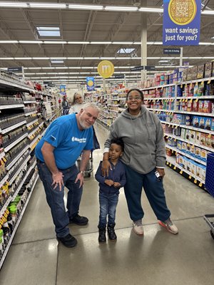 Community Crew member giving out a Meijer gift card during the holiday season!