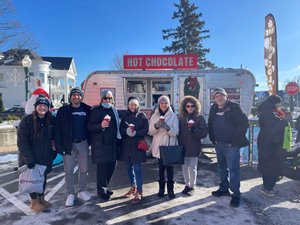 Community Crew members with recipients of free hot chocolate during the winter. 