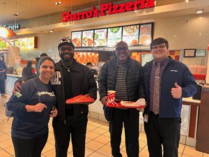 Recipients of free pizza on behalf of Michigan First from Sbarro's Pizza in Grand Rapids.